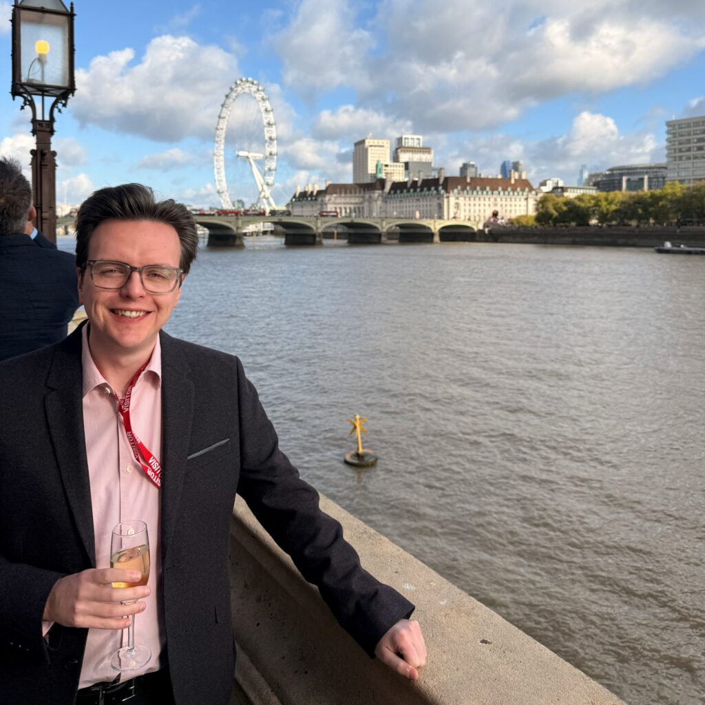 Craig beside the River Thames, at the House of Lords in the Palaces of Westminster.